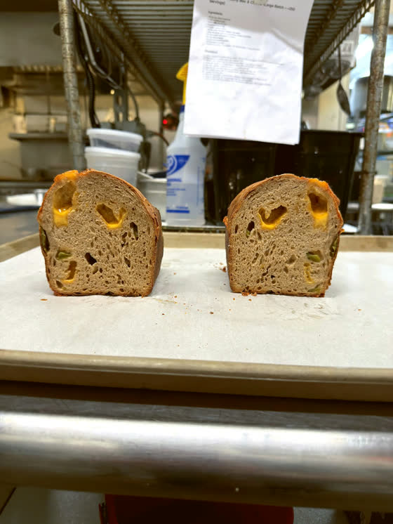 A loaf cut open beside its crust